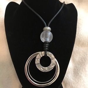 Silver necklace on a leather chain